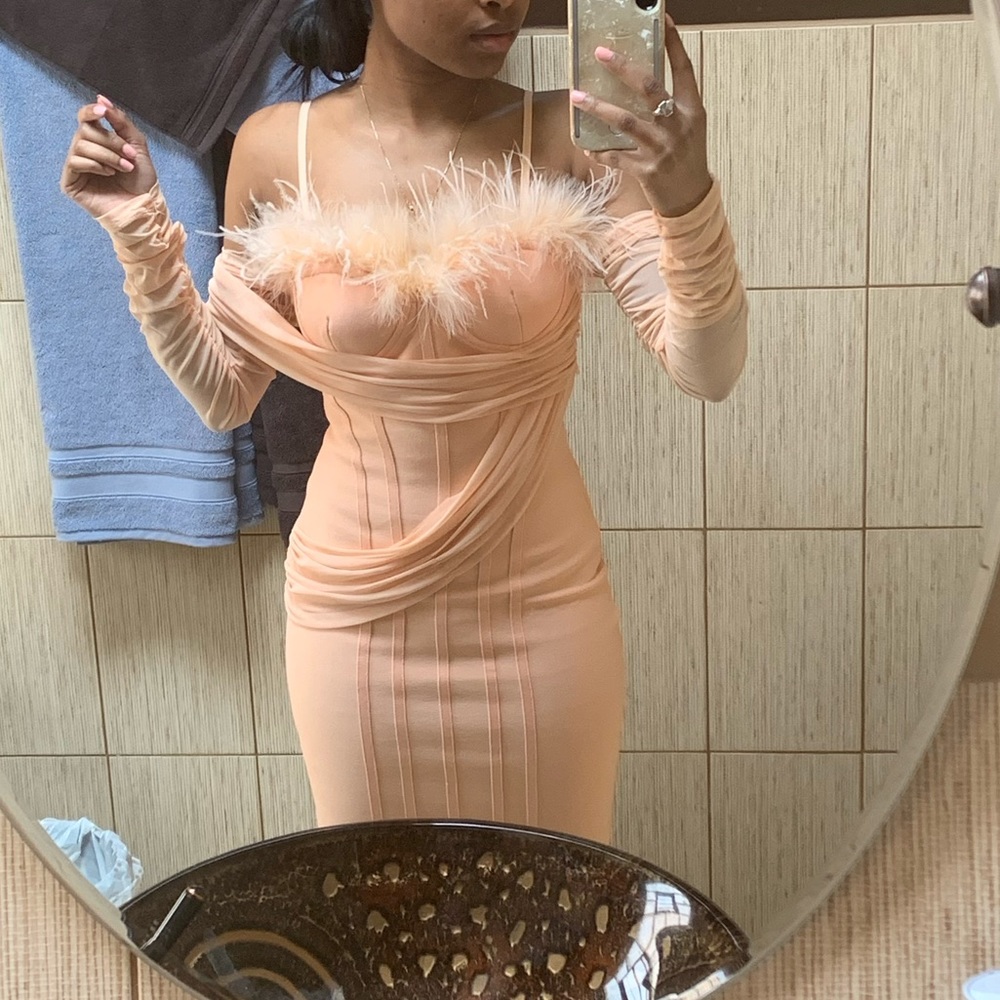 Peach tone asymmetrical dress.